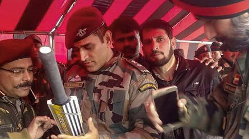 MS Dhoni, who took a two-month break from international cricket, is currently training with the Paramilitary forces (106 Territorial Army Battalion), and he is expected to be with the Army for two weeks. (Photo:Twitter)) MS Dhoni, who took a two-month break from international cricket, is currently training with the Paramilitary forces (106 Territorial Army Battalion), and he is expected to be with the Army for two weeks. (Photo:Twitter))