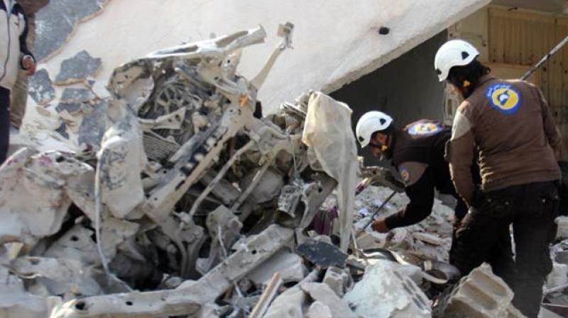 Rescuers look through a destroyed building in the Syrian village of Kfar Jales, on the outskirts of Idlib, following air strikes by Syrian and Russian warplanes. (Photo: AFP) Rescuers look through a destroyed building in the Syrian village of Kfar Jales, on the outskirts of Idlib, following air strikes by Syrian and Russian warplanes. (Photo: AFP)