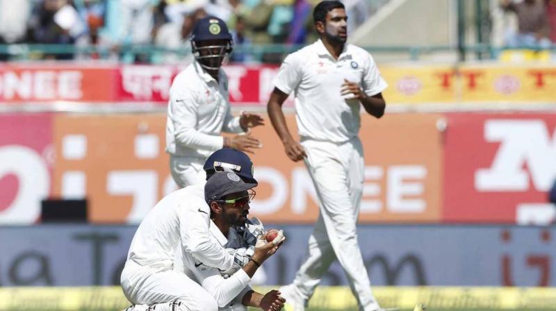 Ajinkya Rahane and Wriddhiman Saha celebrate the wicket of Peter Handscomb. (Photo: BCCI) Ajinkya Rahane and Wriddhiman Saha celebrate the wicket of Peter Handscomb. (Photo: BCCI)