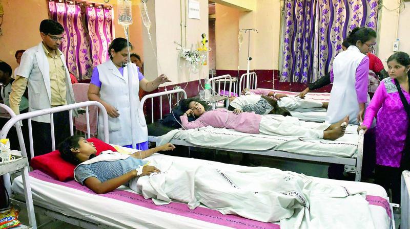 School students being treated at a hospital in New Delhi on Saturday. (Photo: PTI) School students being treated at a hospital in New Delhi on Saturday. (Photo: PTI)