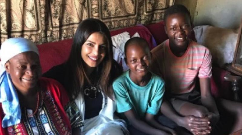 Priyanka with one of the families she met during her trip to Zimbabwe for UNICEF (Pic courtesy: Instagram/ priyankachopra). Priyanka with one of the families she met during her trip to Zimbabwe for UNICEF (Pic courtesy: Instagram/ priyankachopra).