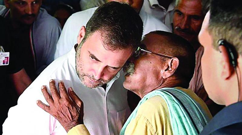 Congress leader Rahul Gandhi listens to a party worker during his visit to Amethi on Wednesday. (PTI) Congress leader Rahul Gandhi listens to a party worker during his visit to Amethi on Wednesday. (PTI)