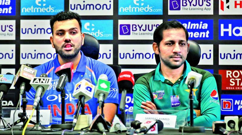 India stand-in skipper Rohit Sharma (left) and his Pakistan counterpart Sarfraz Ahmed. (Photo:AP) India stand-in skipper Rohit Sharma (left) and his Pakistan counterpart Sarfraz Ahmed. (Photo:AP)