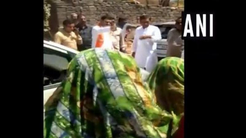 Gujarat Water Supply Minister and BJP leader Kunvarji Bavaliya questioned a group of women, who were protesting against drinking water crisis in their village, whether they voted for him or not in the last election. (Photo: ANI) Gujarat Water Supply Minister and BJP leader Kunvarji Bavaliya questioned a group of women, who were protesting against drinking water crisis in their village, whether they voted for him or not in the last election. (Photo: ANI)