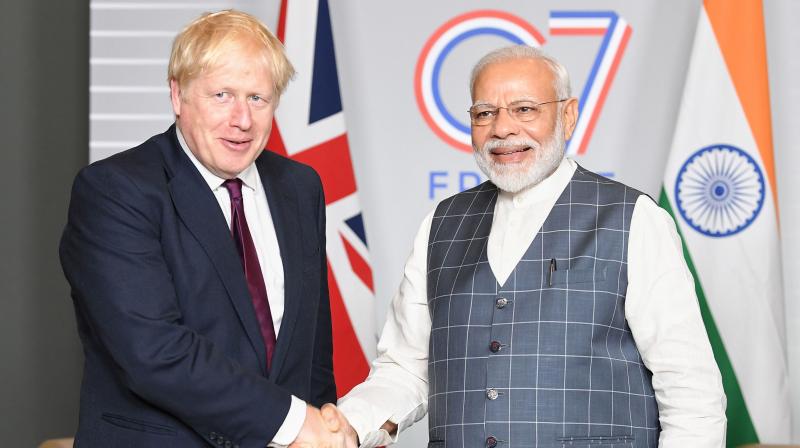 Prime Minister Narendra Modi broke the news of England’s dramatic win over Australia in the ongoing Ashes series to UK PM Boris Johnson. (Photo: AFP) Prime Minister Narendra Modi broke the news of England’s dramatic win over Australia in the ongoing Ashes series to UK PM Boris Johnson. (Photo: AFP)