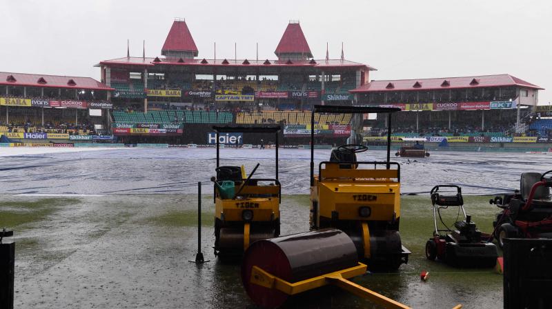 Around 30 per cent uncovered part of the ground has lots of water and water puddles were all over the outfield. (Photo: AFP) Around 30 per cent uncovered part of the ground has lots of water and water puddles were all over the outfield. (Photo: AFP)