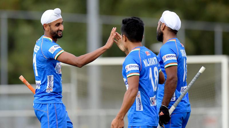 Mandeep Singh (left) with his teammates in a file photo. (Photo: PTI) Mandeep Singh (left) with his teammates in a file photo. (Photo: PTI)