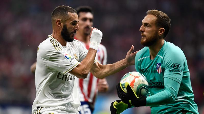 Karim Benzema came closest to scoring at the Wanda Metropolitano but Atletico goalkeeper Jan Oblak made a fine save. (Photo: AFP) Karim Benzema came closest to scoring at the Wanda Metropolitano but Atletico goalkeeper Jan Oblak made a fine save. (Photo: AFP)
