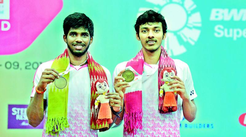 Gold medallists Satwiksairaj Rankireddy (left) and Chirag Shetty are all smiles as they pose with their medals after emerging champions in the men’s doubles final at the Hyderabad Open badminton tournament in Hyderabad on Sunday. (Image: AFP) Gold medallists Satwiksairaj Rankireddy (left) and Chirag Shetty are all smiles as they pose with their medals after emerging champions in the men’s doubles final at the Hyderabad Open badminton tournament in Hyderabad on Sunday. (Image: AFP)