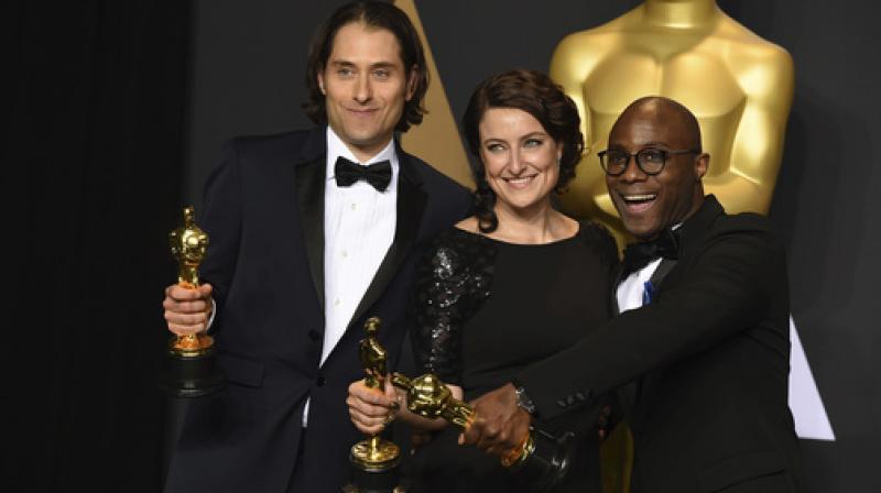 Jeremy Kleiner, from left, Adele Romanski and Barry Jenkins, winners of the award for best picture for Jeremy Kleiner, from left, Adele Romanski and Barry Jenkins, winners of the award for best picture for