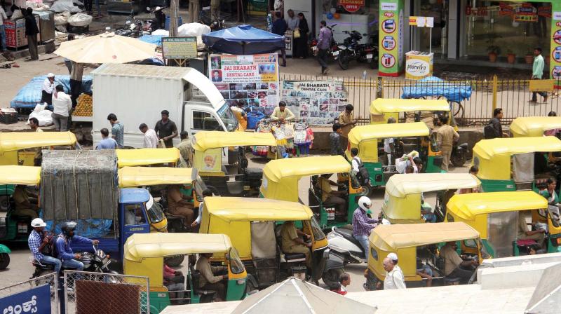 With autos and private buses illegally occupying the space meant for them, BMTC buses are forced to stop in the middle of the road, holding up traffic. With autos and private buses illegally occupying the space meant for them, BMTC buses are forced to stop in the middle of the road, holding up traffic.