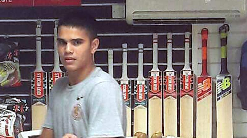 As the scribes hastily started clicking photographs, Arjun Tendulkar's facial expression was one of amusement bordering on irritation. He quietly walked past the media into the nets, spoke to his coach and then started batting against spinners. (Photo: PTI) As the scribes hastily started clicking photographs, Arjun Tendulkar's facial expression was one of amusement bordering on irritation. He quietly walked past the media into the nets, spoke to his coach and then started batting against spinners. (Photo: PTI)