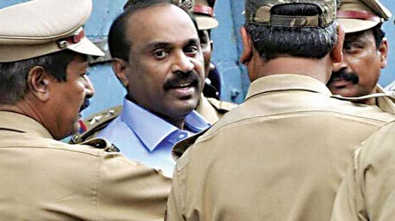 A file photo of policemen taking mIning baron G Janardhan Reddy to court A file photo of policemen taking mIning baron G Janardhan Reddy to court