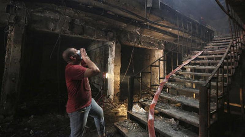 Rescue workers look for survivors after the blast. (Photo: AP) Rescue workers look for survivors after the blast. (Photo: AP)