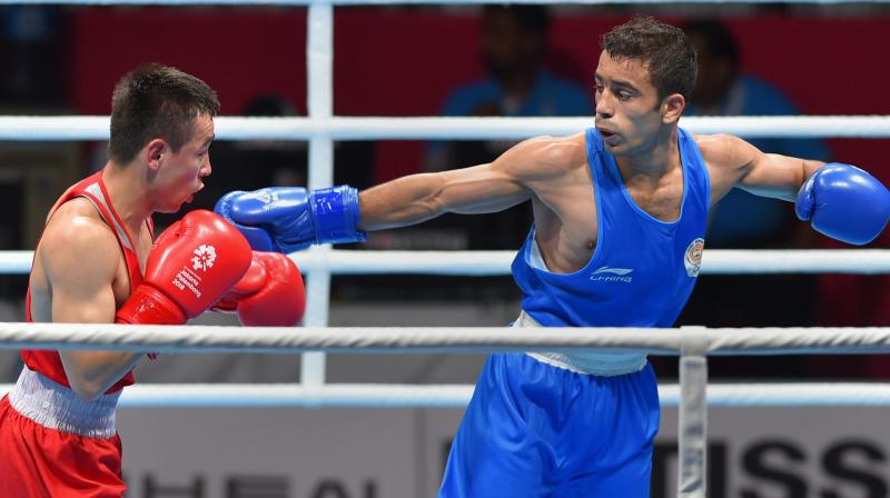 Amit Panghal (Blue) displayed a soldier's grit to stun the reigning Olympic champion for India's only boxing gold and two 50-plus bridge players proved that age is just a number with their top finishes as the country achieved its best ever medal haul at the Asian Games. (Photo: PTI) Amit Panghal (Blue) displayed a soldier's grit to stun the reigning Olympic champion for India's only boxing gold and two 50-plus bridge players proved that age is just a number with their top finishes as the country achieved its best ever medal haul at the Asian Games. (Photo: PTI)