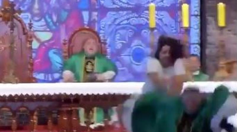 A 32-year-old woman pushed a priest in Brazil. (Photo: Screengrab/Twitter/@TheFigen) A 32-year-old woman pushed a priest in Brazil. (Photo: Screengrab/Twitter/@TheFigen)