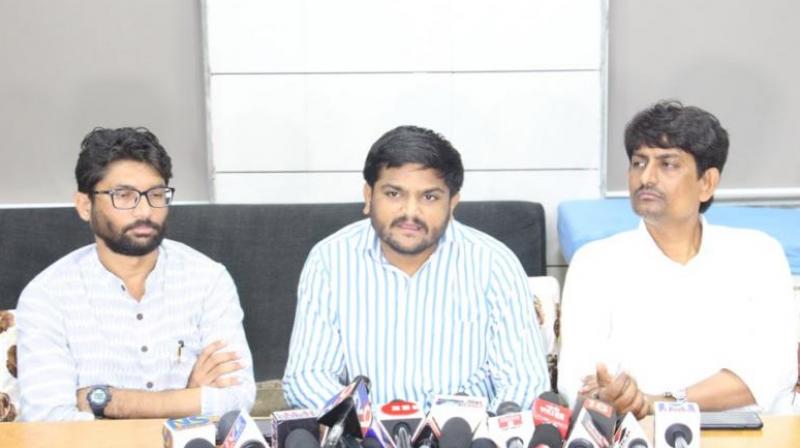 Thakor, a Congress MLA, along with independent legislator Mevani and Patel, on Thursday "raided" the house of a woman, identified as Kanchanben Makwana. (Photo: Twitter | @HardikPatel) Thakor, a Congress MLA, along with independent legislator Mevani and Patel, on Thursday "raided" the house of a woman, identified as Kanchanben Makwana. (Photo: Twitter | @HardikPatel)