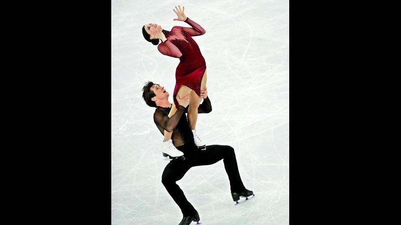 Tessa Virtue and Scott Moir get hero's welcome in London Tessa Virtue and Scott Moir get hero's welcome in London