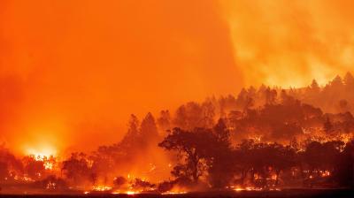 In this long exposure photograph, burning hills create a flaming landscape during the Glass fire in Napa County's St. Helena, California on September 27, 2020. - A wildfire with a 