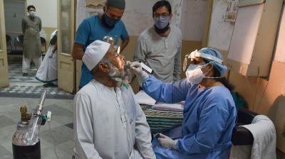  A doctor checks a Black Fungus infected patient, at ENT Hospital in Hyderabad, May 26,2021. (PTI Photo)