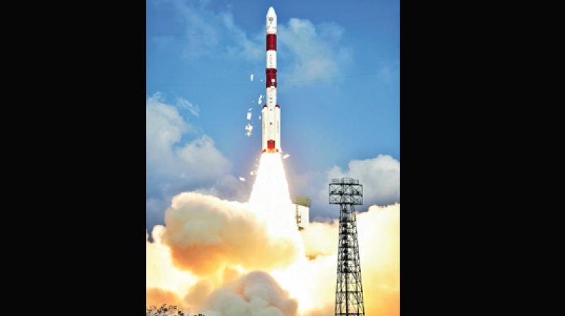 Space agency Indian Space Research Organisation successfully launching a record 104 satellites, including India’s earth observation satellite on-board PSLV-C37/Cartosat2 Series from the spaceport of Sriharikota on Wednesday. (Photo: AP) Space agency Indian Space Research Organisation successfully launching a record 104 satellites, including India’s earth observation satellite on-board PSLV-C37/Cartosat2 Series from the spaceport of Sriharikota on Wednesday. (Photo: AP)