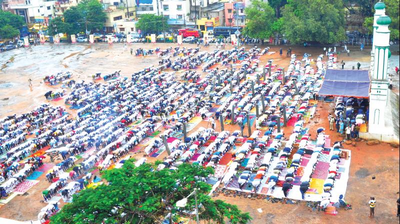 Muslims offer prayers at the waterlogged Chamarajpet Eidga Maidan on the occasion of Bakrid in Bengaluru on Saturday. (Photo: Satish B.) Muslims offer prayers at the waterlogged Chamarajpet Eidga Maidan on the occasion of Bakrid in Bengaluru on Saturday. (Photo: Satish B.)