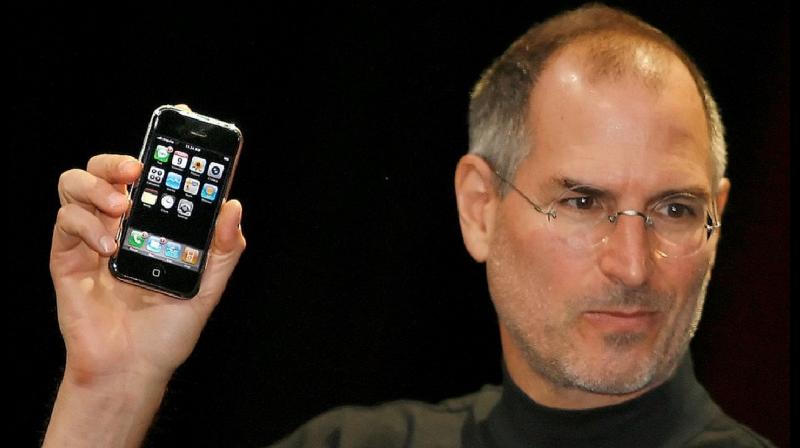 2007: Apple CEO Steve Jobs unveiling the first iPhone, the iPhone 2G. 2007: Apple CEO Steve Jobs unveiling the first iPhone, the iPhone 2G.