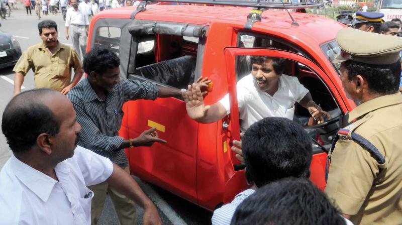 Workers of various trade unions block a private vehicle during the vehicle strike in Thiruvananthapuram on Friday. (Photo: A.V. MUZAFAR) Workers of various trade unions block a private vehicle during the vehicle strike in Thiruvananthapuram on Friday. (Photo: A.V. MUZAFAR)