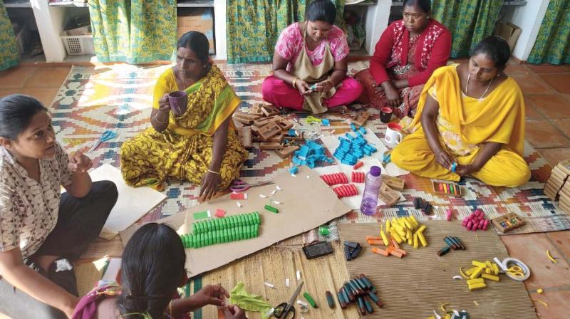 Adivasi women, working with NGO Hoopoe on a Hill, make bees wax crayons and wraps at Kodaikanal Adivasi women, working with NGO Hoopoe on a Hill, make bees wax crayons and wraps at Kodaikanal