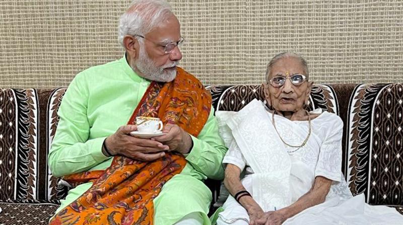 Prime Minister Narendra Modi meets his mother Hiraba at her residence on eve of second phase Gujarat Assembly elections, in Gandhinagar. (PTI)