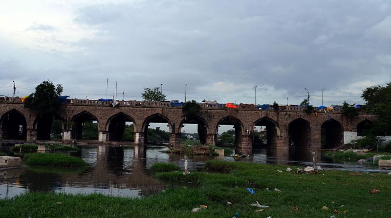 A narrow pathway, which passes off as a bridge, is constructed on the river course, channelising water from Himayathsagar when its crest gates are opened. A narrow pathway, which passes off as a bridge, is constructed on the river course, channelising water from Himayathsagar when its crest gates are opened.