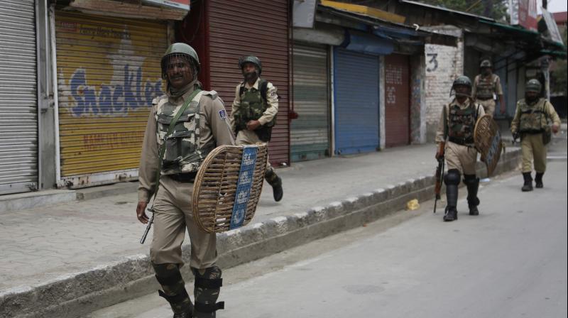 Paramilitary soldiers patrol during restrictions in Srinagar. (Photo: AP) Paramilitary soldiers patrol during restrictions in Srinagar. (Photo: AP)