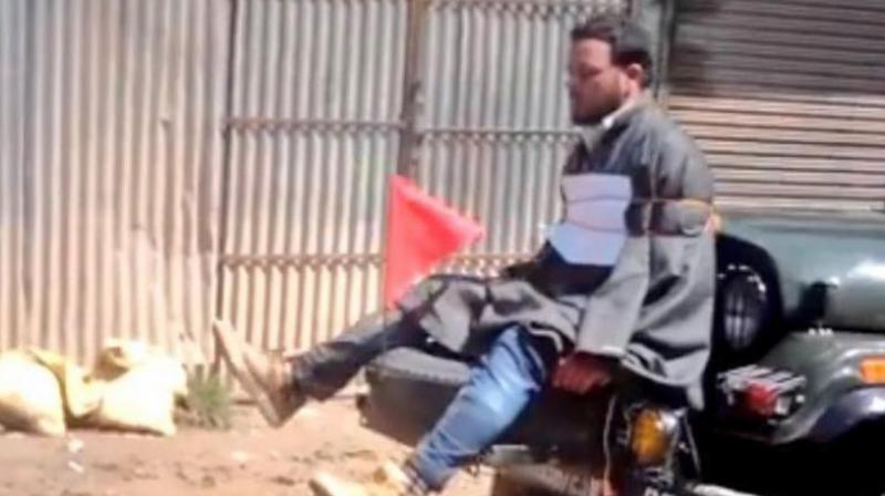 Youth tied to an Army jeep in Jammu and Kashmir (Photo: video grab) Youth tied to an Army jeep in Jammu and Kashmir (Photo: video grab)