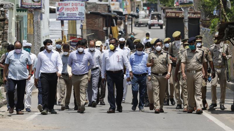 Health staff and policemen move into a coronavirus hotspot area in Allahabad to conduct testing for the coronavirus on Saturday, April 25, 2020. (AP)