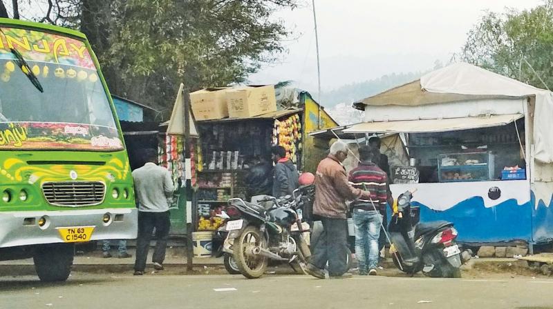 Aavin booth and other petty shops on footpath opposite Central bus stand in Ooty. —DC Aavin booth and other petty shops on footpath opposite Central bus stand in Ooty. —DC