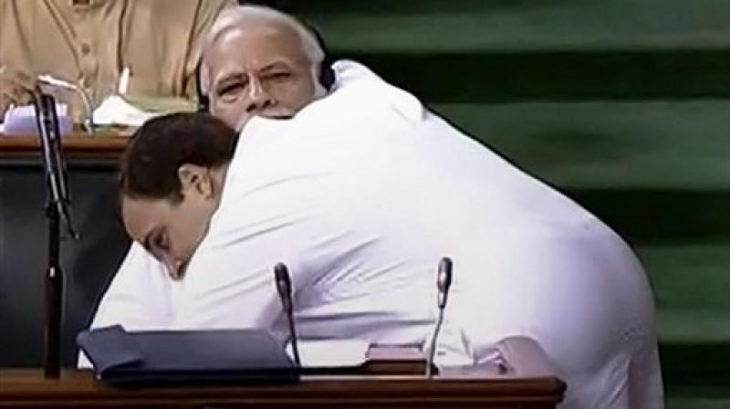 Congress President Rahul Gandhi hugs Prime Minister Narendra Modi after his speech in the Lok Sabha on 'no-confidence motion' during the Monsoon Session of Parliament, in New Delhi. (LSTV GRAB via PTI) Congress President Rahul Gandhi hugs Prime Minister Narendra Modi after his speech in the Lok Sabha on 'no-confidence motion' during the Monsoon Session of Parliament, in New Delhi. (LSTV GRAB via PTI)