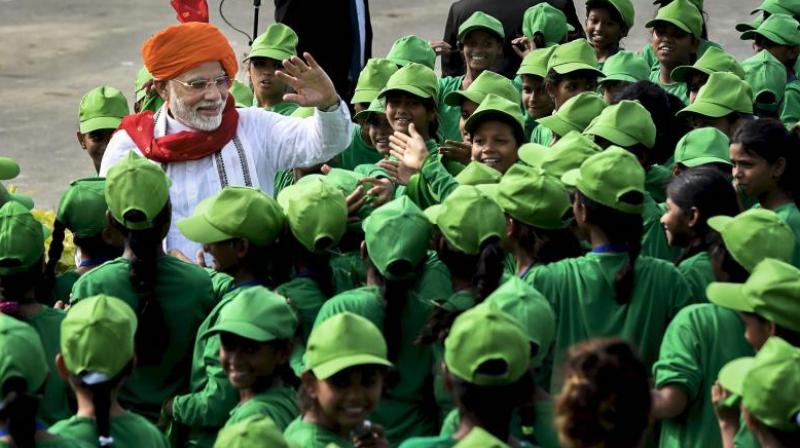 Prime Minister Narendra Modi interacts with children during Independence Day celebrations at the Red Fort, in New Delhi on Wednesday. (Photo: PTI) Prime Minister Narendra Modi interacts with children during Independence Day celebrations at the Red Fort, in New Delhi on Wednesday. (Photo: PTI)