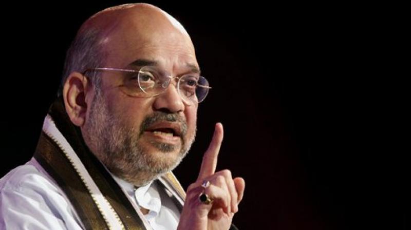 BJP president Amit Shah expressed unhappiness over his party MPs bunking Rajya Sabha session on Monday. (Photo: PTI) BJP president Amit Shah expressed unhappiness over his party MPs bunking Rajya Sabha session on Monday. (Photo: PTI)