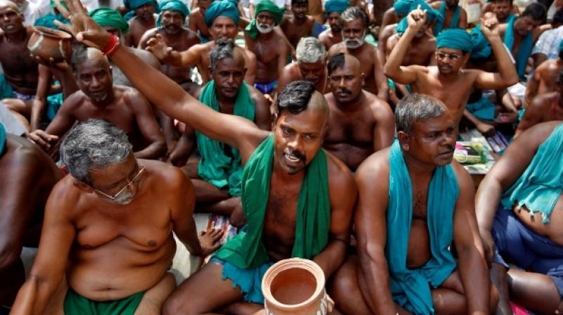 Farmers from Tamil Nadu pose half shaved during a protest demanding a drought-relief package from the Centre, in New Delhi, on April 3, 2017. (Photo: PTI) Farmers from Tamil Nadu pose half shaved during a protest demanding a drought-relief package from the Centre, in New Delhi, on April 3, 2017. (Photo: PTI)
