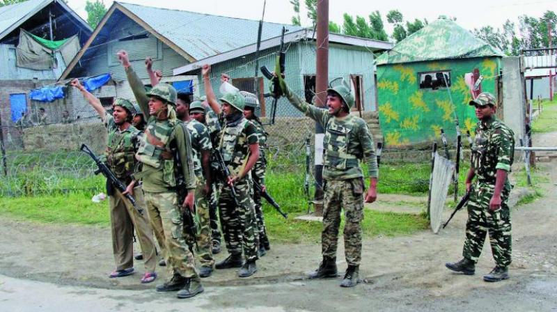 Security personnel celebrate after killing four suicide attackers who attacked a CRPF camp at Sumbal in Bandipora district of north Kashmir. (Photo: PTI) Security personnel celebrate after killing four suicide attackers who attacked a CRPF camp at Sumbal in Bandipora district of north Kashmir. (Photo: PTI)