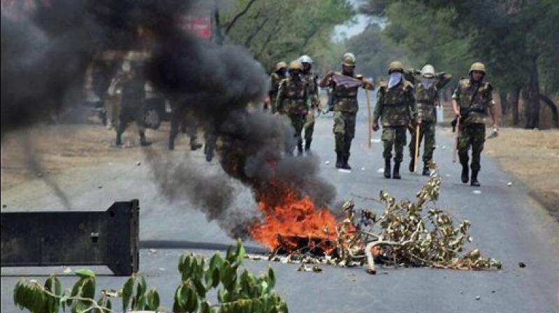 Farmers stage protest at Indore-Bhopal highway in June. (Photo: PTI) Farmers stage protest at Indore-Bhopal highway in June. (Photo: PTI)