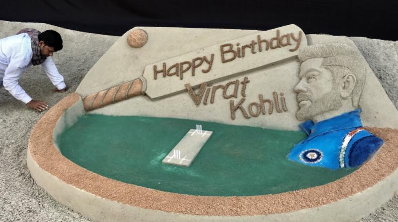 Noted sand artist Sudarsan Pattnaik Monday made a cricket-themed sand art installation here to wish ace batsman Virat Kohli on his 30th birthday. (Photo: Twitter / Sudarsan Pattnaik) Noted sand artist Sudarsan Pattnaik Monday made a cricket-themed sand art installation here to wish ace batsman Virat Kohli on his 30th birthday. (Photo: Twitter / Sudarsan Pattnaik)
