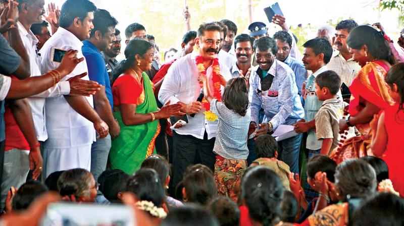 A little girl welcomes MNM party president Kamal Haasan at the Gram Sabha meeting held at Adigathur village on Tuesday. (Photo: DC) A little girl welcomes MNM party president Kamal Haasan at the Gram Sabha meeting held at Adigathur village on Tuesday. (Photo: DC)