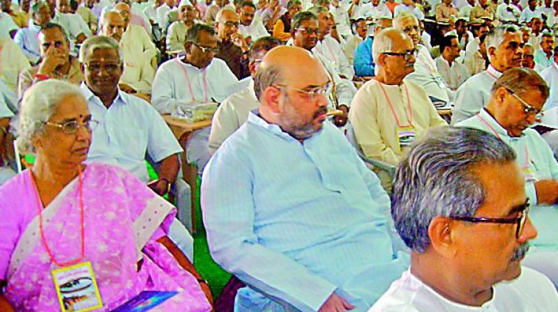 BJP president Amit Shah sitting almost anonymously in the audience at an RSS conclave in Lucknow. Mr Shah’s deference for the ideological fountainhead underscores the importance of the swayamsevaks for the party’s victory. BJP president Amit Shah sitting almost anonymously in the audience at an RSS conclave in Lucknow. Mr Shah’s deference for the ideological fountainhead underscores the importance of the swayamsevaks for the party’s victory.