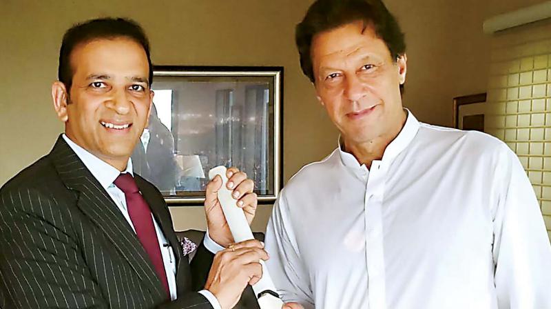 Indian envoy to Pakistan Ajay Bisaria presents a cricket bat signed by the Indian cricket team to Pak PM-elect Imran Khan in Islamabad on Friday (Photo: AFP) Indian envoy to Pakistan Ajay Bisaria presents a cricket bat signed by the Indian cricket team to Pak PM-elect Imran Khan in Islamabad on Friday (Photo: AFP)