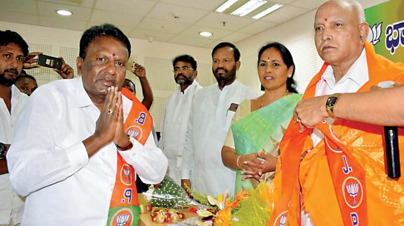BJP state president B.S. Yeddyurappa welcomes Congress and JD(S) leaders who joined the party in Bengaluru on Monday. BJP state president B.S. Yeddyurappa welcomes Congress and JD(S) leaders who joined the party in Bengaluru on Monday.