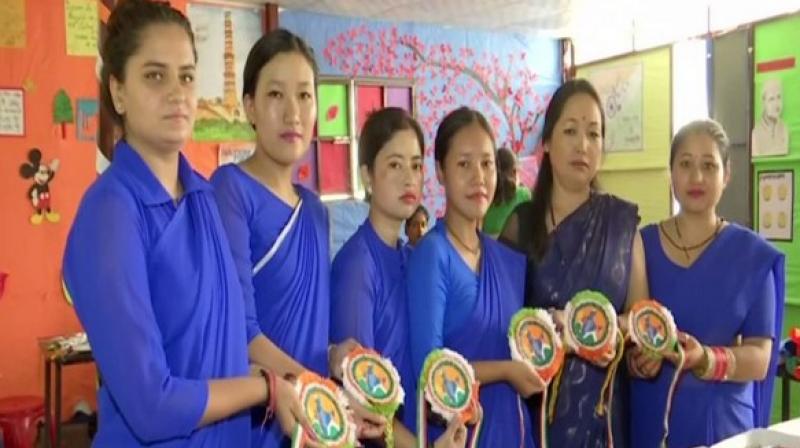 These women have made all the rakhis on the theme of Independence Day with the help of grains as both the occasions are falling on the same day. (Photo: ANI) These women have made all the rakhis on the theme of Independence Day with the help of grains as both the occasions are falling on the same day. (Photo: ANI)