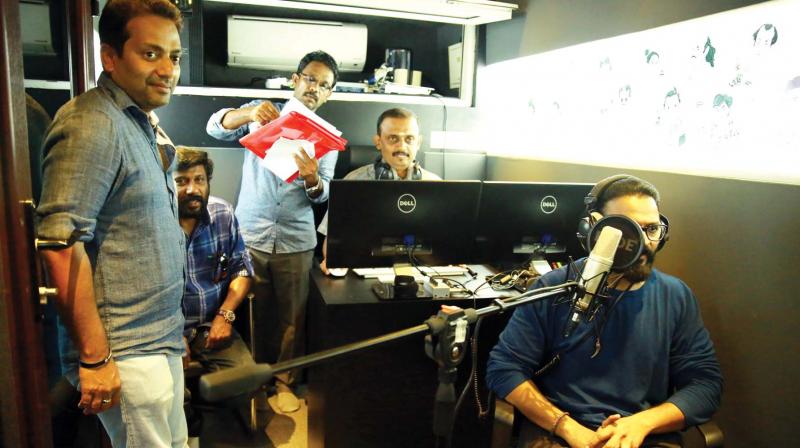 Jayasurya giving his voice at the ‘Dubbing on Wheels ‘set up for Fukhri. Jayasurya giving his voice at the ‘Dubbing on Wheels ‘set up for Fukhri.