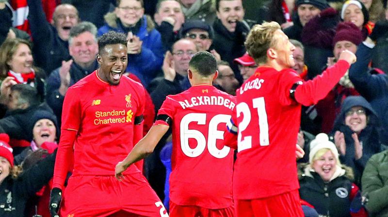 Liverpool’s Divock Origi (left) celebrates scoring his side’s first goal of the game with teammates during the English League Cup quarterfinal against Leeds United at Anfield in Liverpool, England, on Tuesday. Liverpool won the match 2-0. (Photo: AP) Liverpool’s Divock Origi (left) celebrates scoring his side’s first goal of the game with teammates during the English League Cup quarterfinal against Leeds United at Anfield in Liverpool, England, on Tuesday. Liverpool won the match 2-0. (Photo: AP)