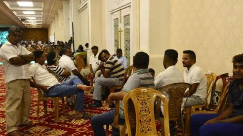 Thousands of loyalists from across the country are camped out at the Temple Trees residence in Colombo, a colonial-era bungalow where Ranil Wickremesinghe has been holed up since his shock dismissal more than a week ago. (Photo: AFP) Thousands of loyalists from across the country are camped out at the Temple Trees residence in Colombo, a colonial-era bungalow where Ranil Wickremesinghe has been holed up since his shock dismissal more than a week ago. (Photo: AFP)
